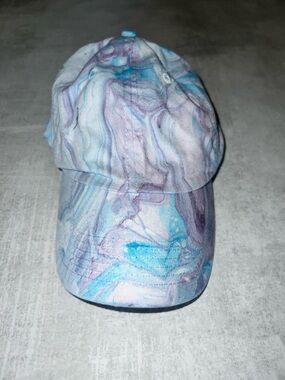 Urban Outfitters blue/purple marbled baseball cap featuring a psychedelic